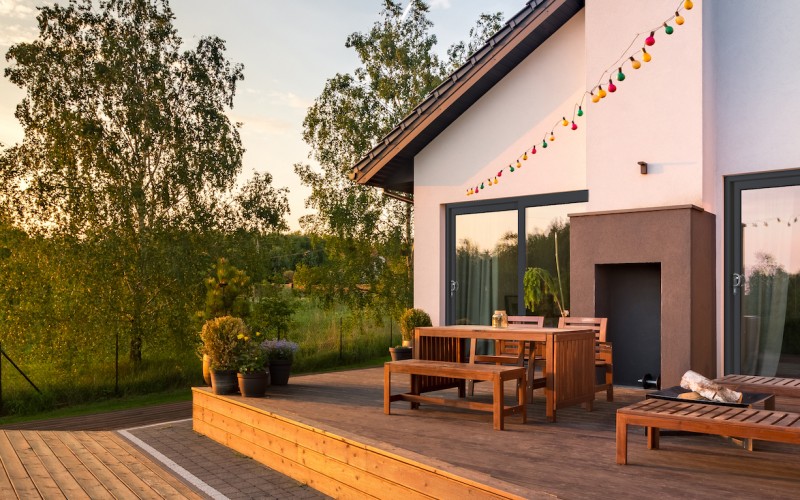 Woman drinking tea and looking out of window