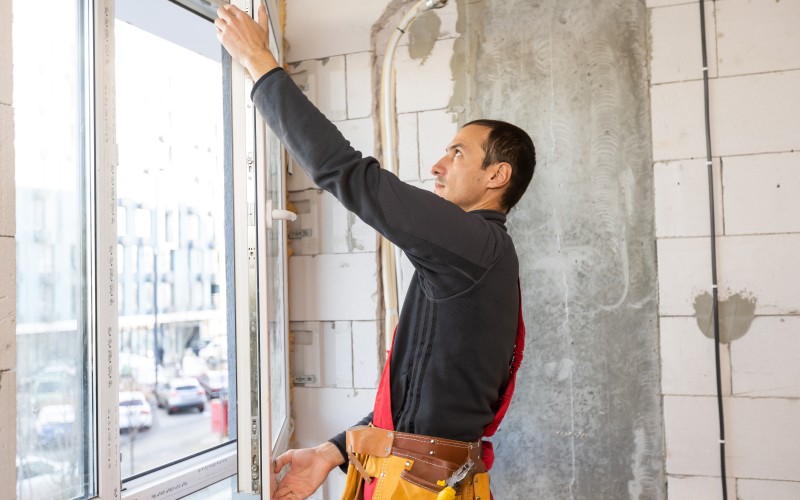 construction-worker-repairing-windows-house.jpg